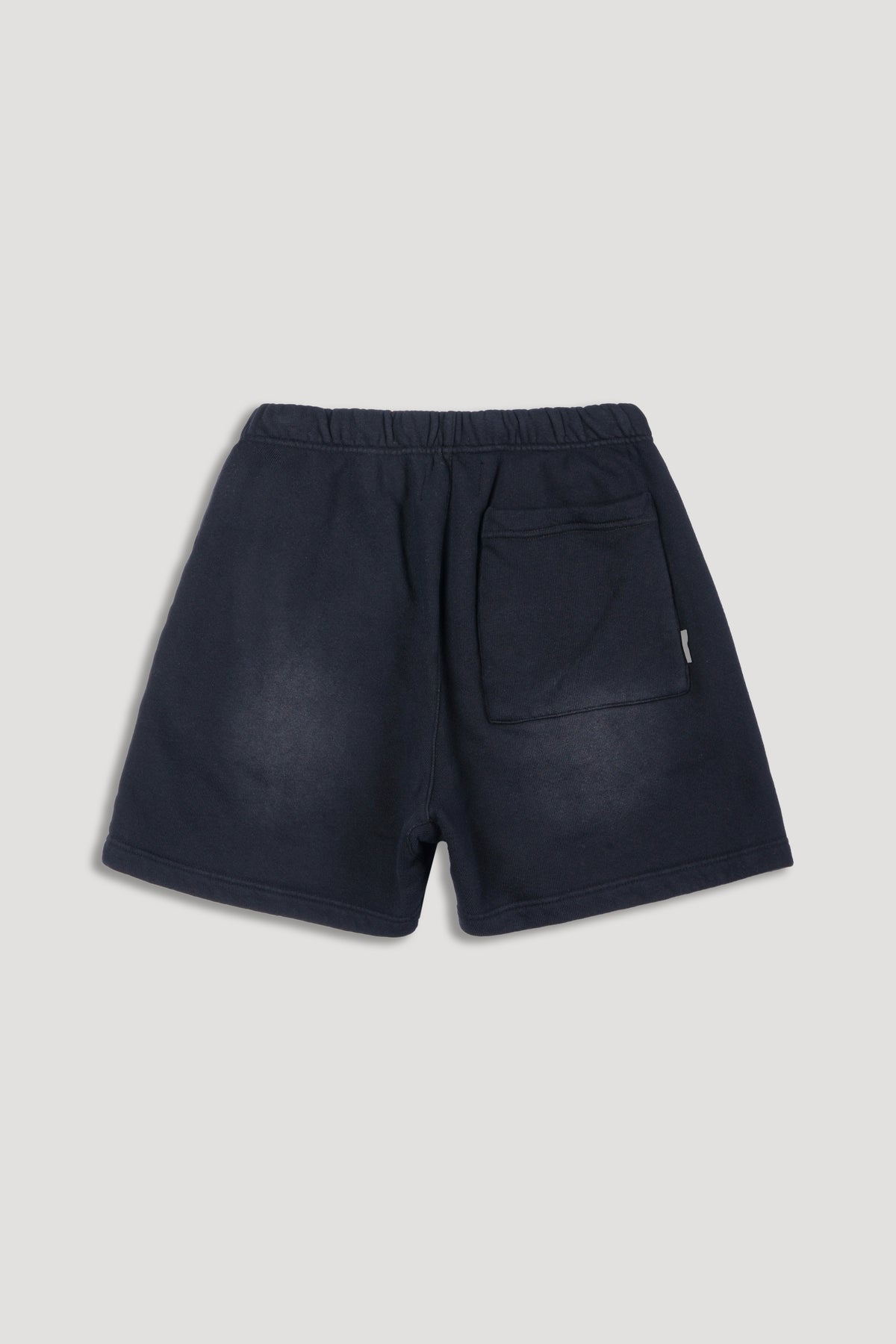 IYKYK Patched Oversized Sweat Short in Black Sun Fade