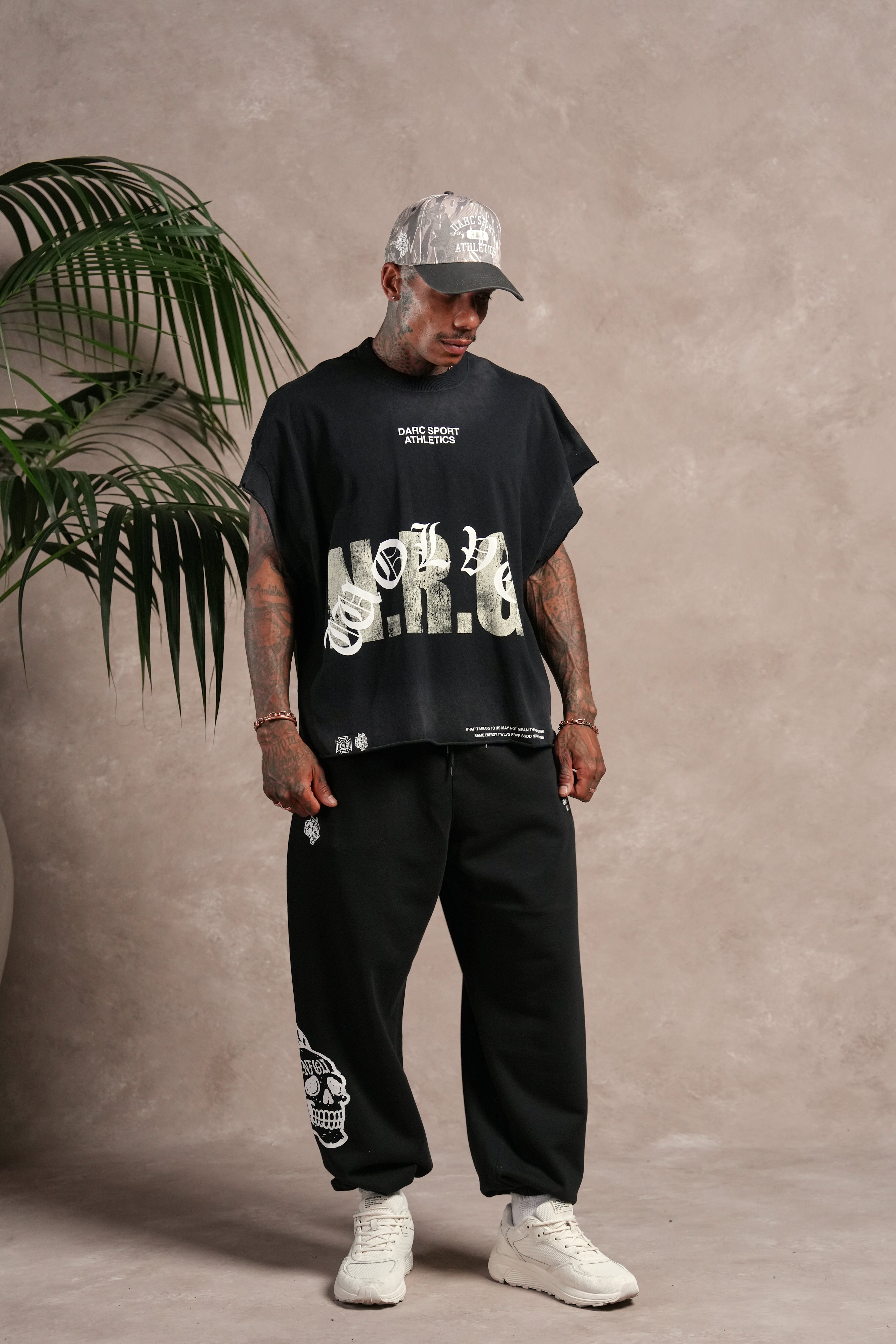 N.R.G. Grunge Cut-Off Mid Length Raw Hem Tee in Black Drift Wash