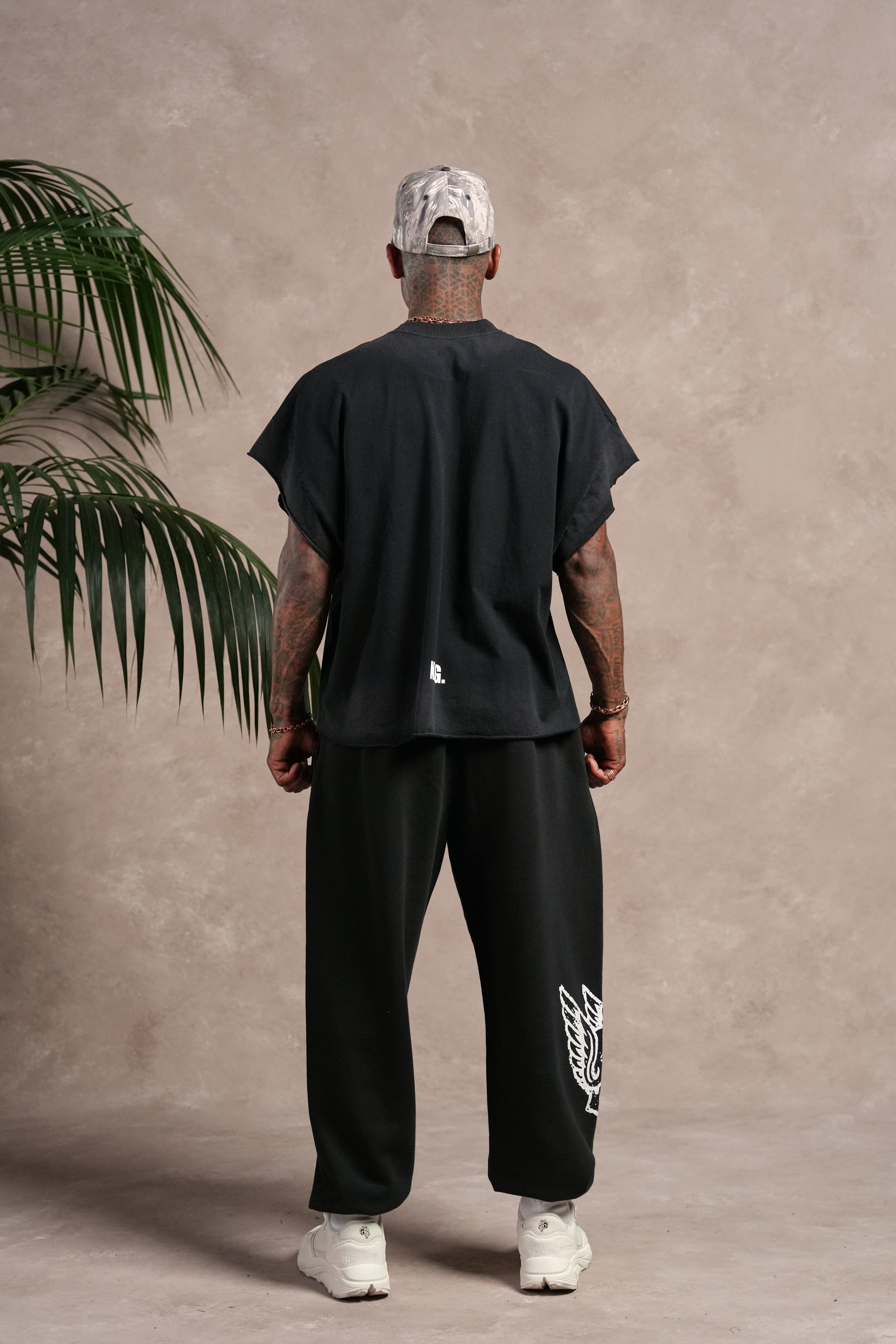 N.R.G. Grunge Cut-Off Mid Length Raw Hem Tee in Black Drift Wash