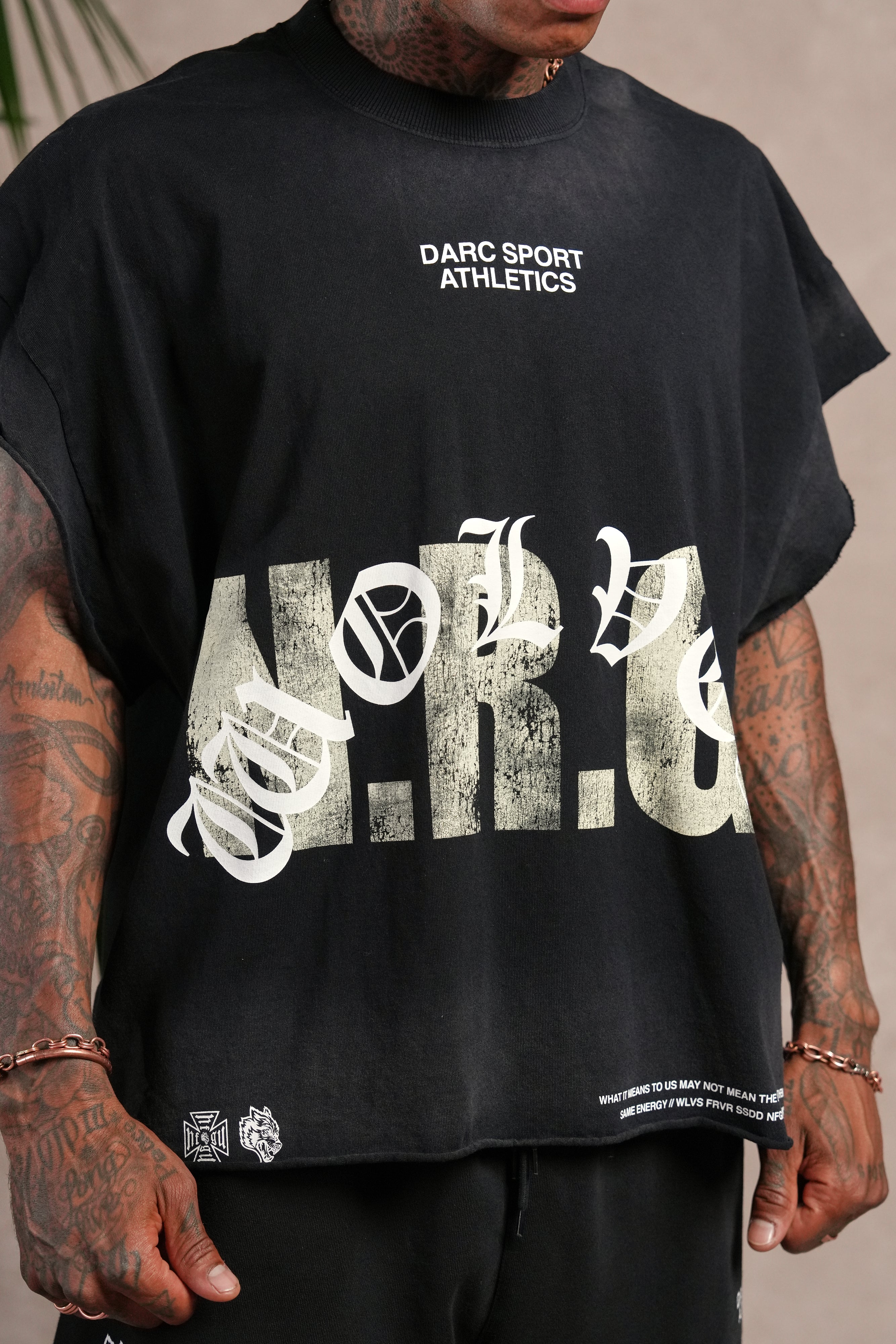 N.R.G. Grunge Cut-Off Mid Length Raw Hem Tee in Black Drift Wash