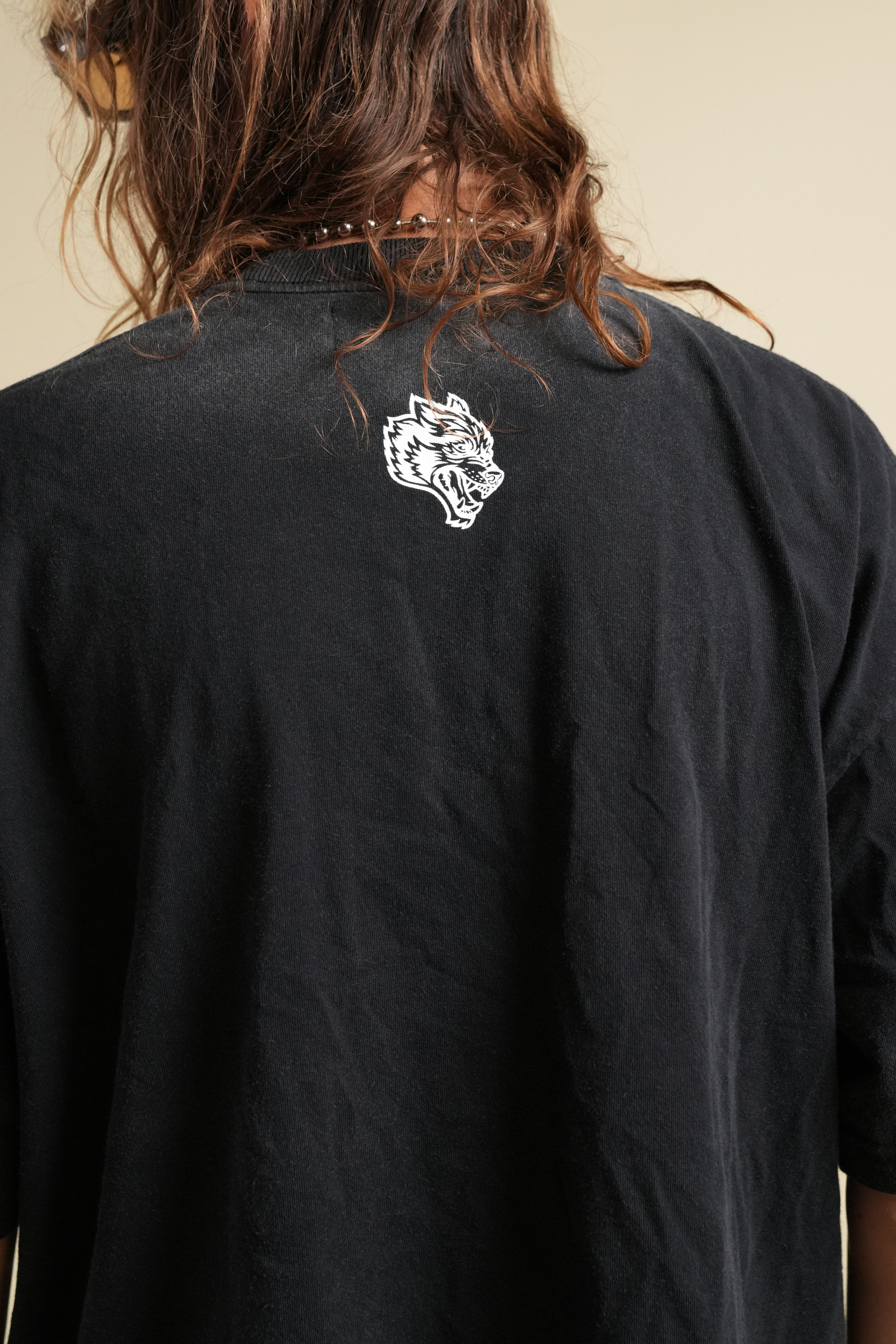 Ohana Wolves Club Grunge Raw Hem Mid Length Tee in Black Drift Wash