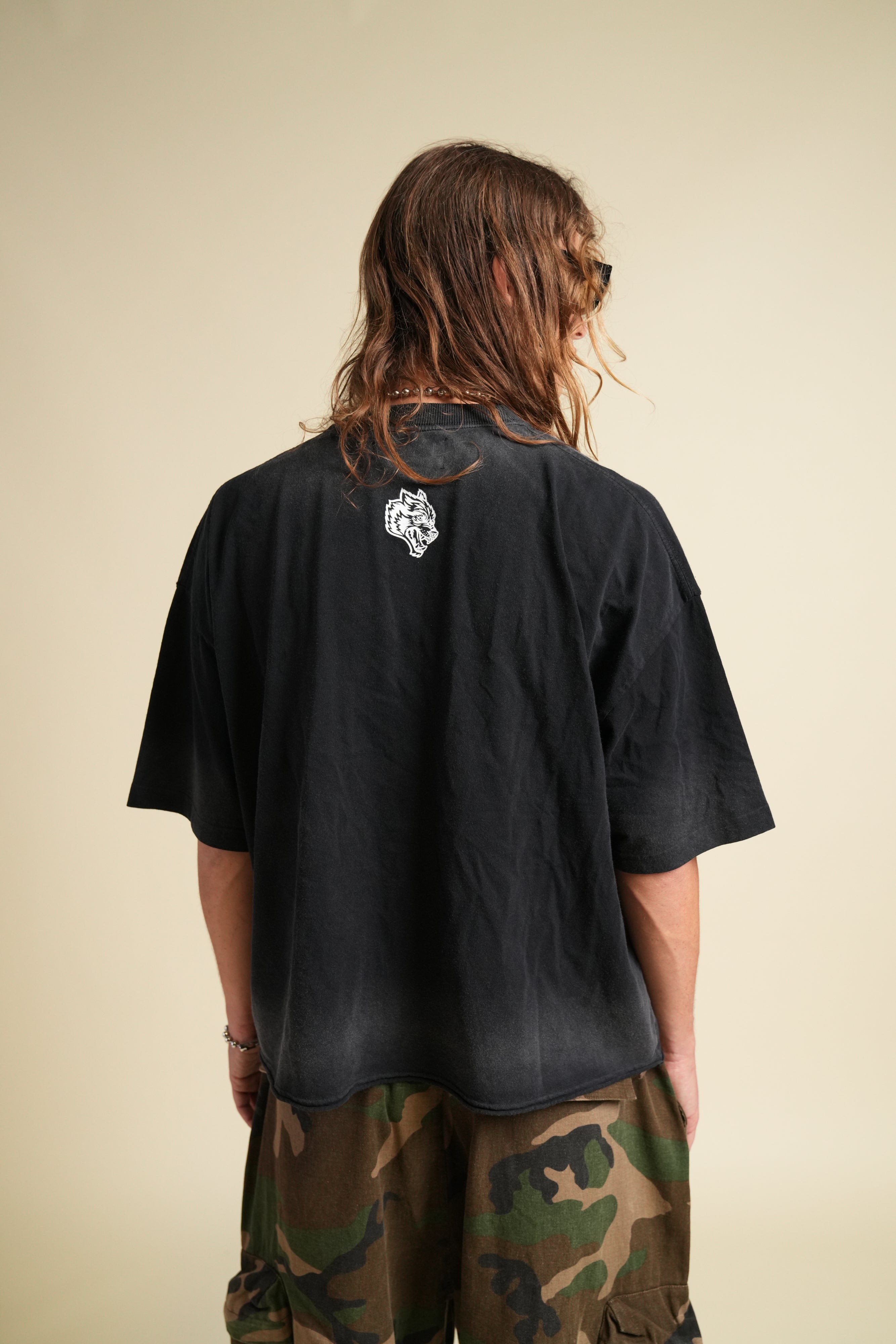 Ohana Wolves Club Grunge Raw Hem Mid Length Tee in Black Drift Wash