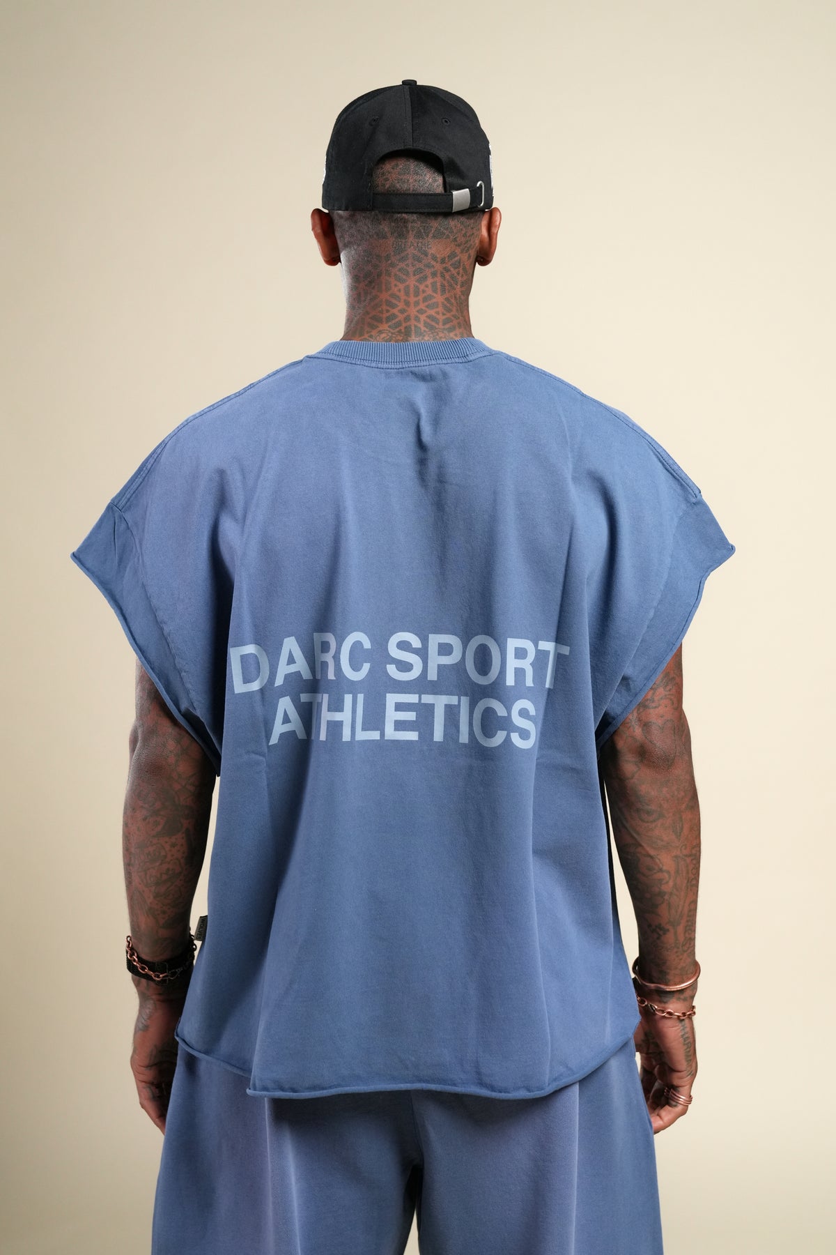 Darc Sport Athletics Grunge Cut-Off Tee in Washed Denim Sunfade