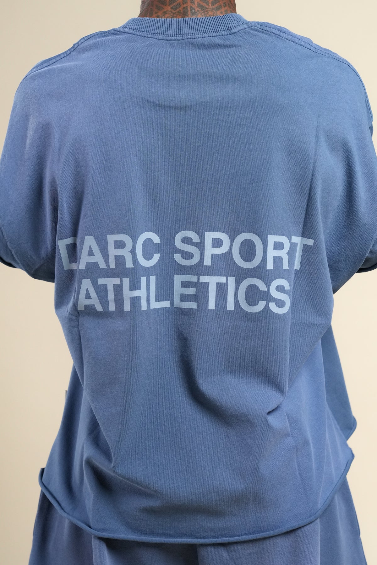 Darc Sport Athletics Grunge Cut-Off Tee in Washed Denim Sunfade