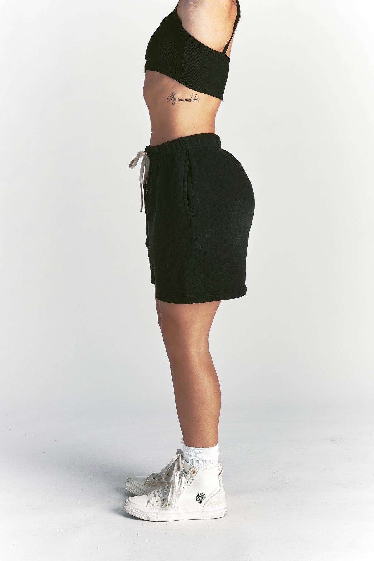 IYKYK Patched Oversized Sweat Short in Black Sun Fade
