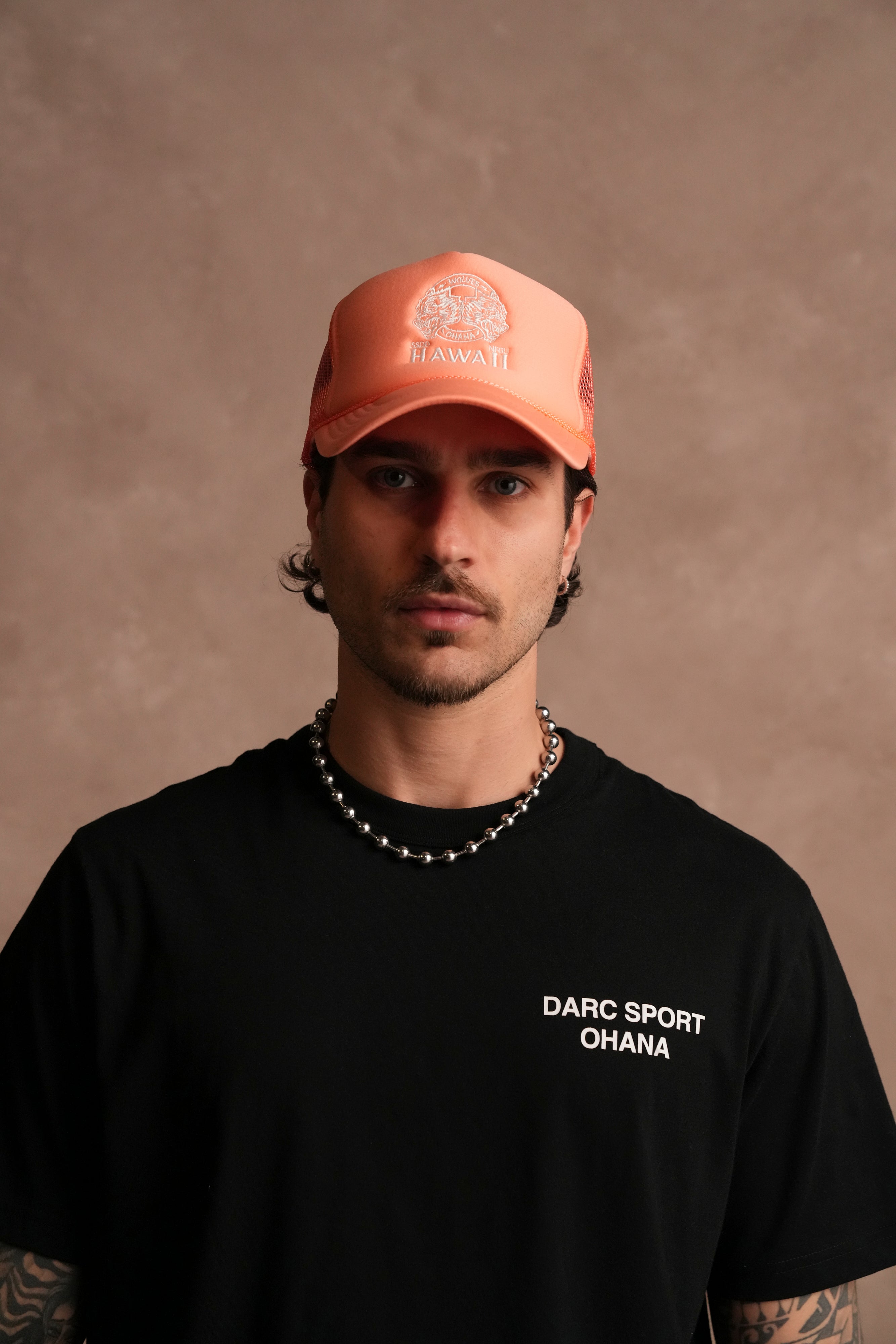 Wolves Ohana Trucker Hat in Neon Coral