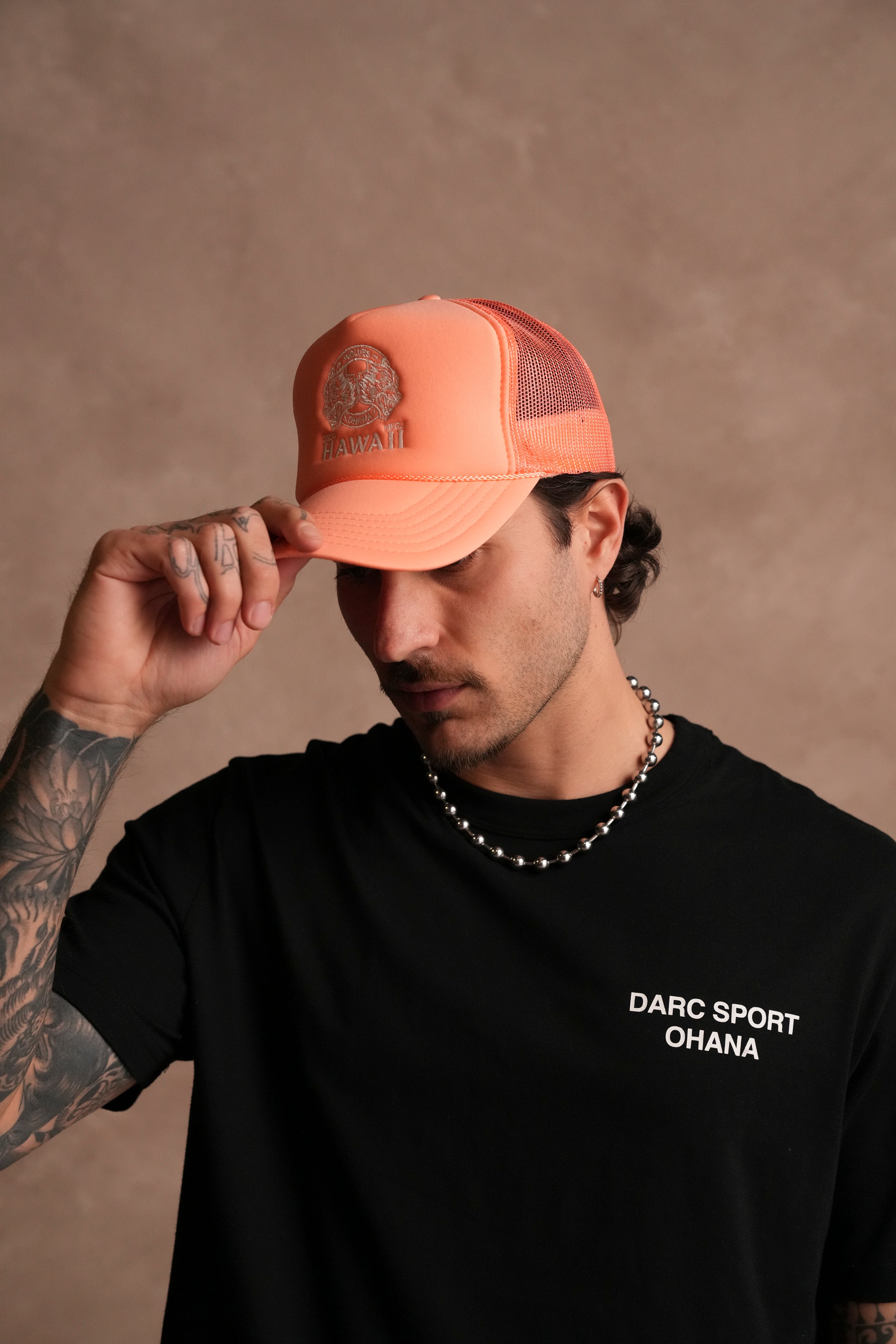 Wolves Ohana Trucker Hat in Neon Coral