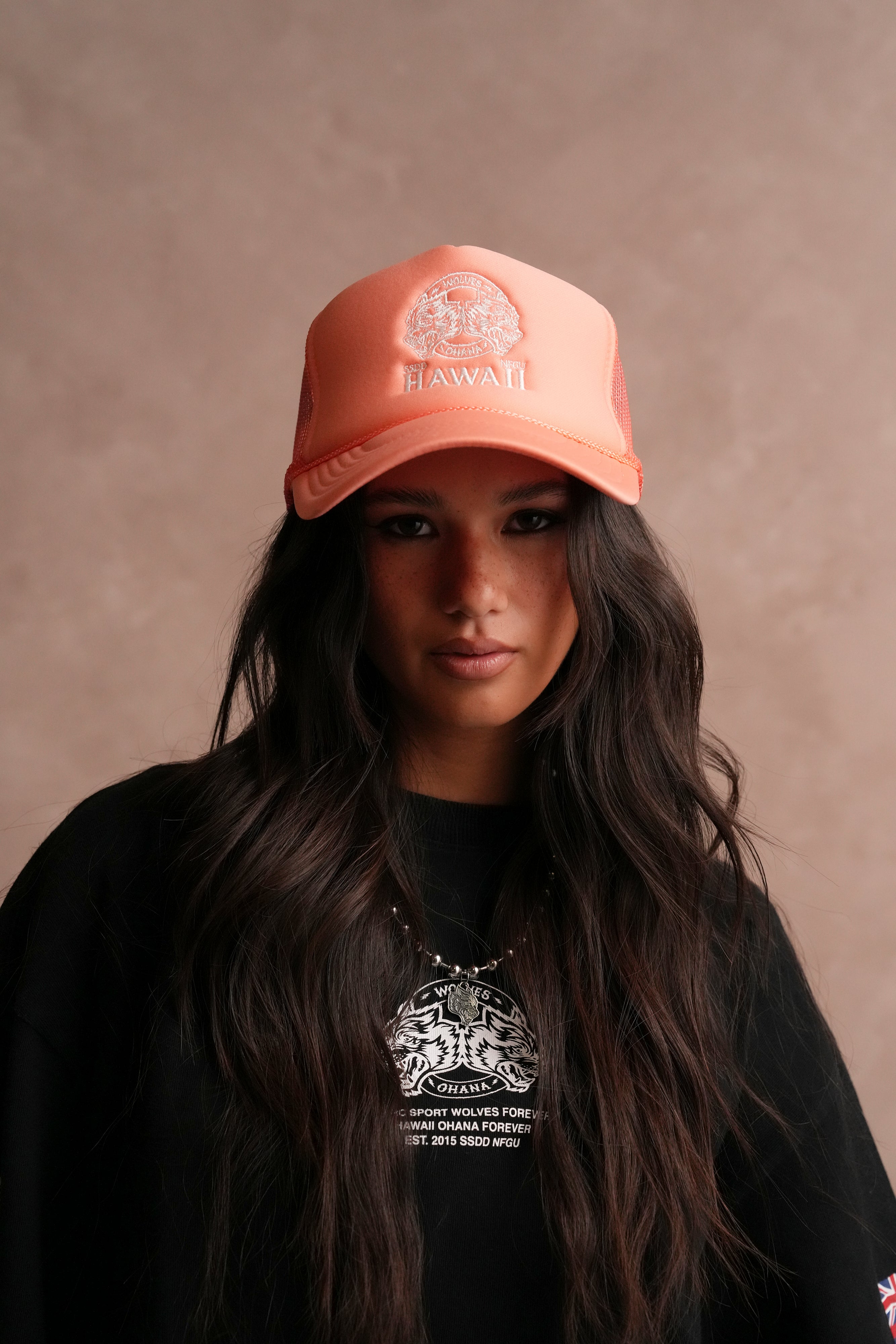 Wolves Ohana Trucker Hat in Neon Coral