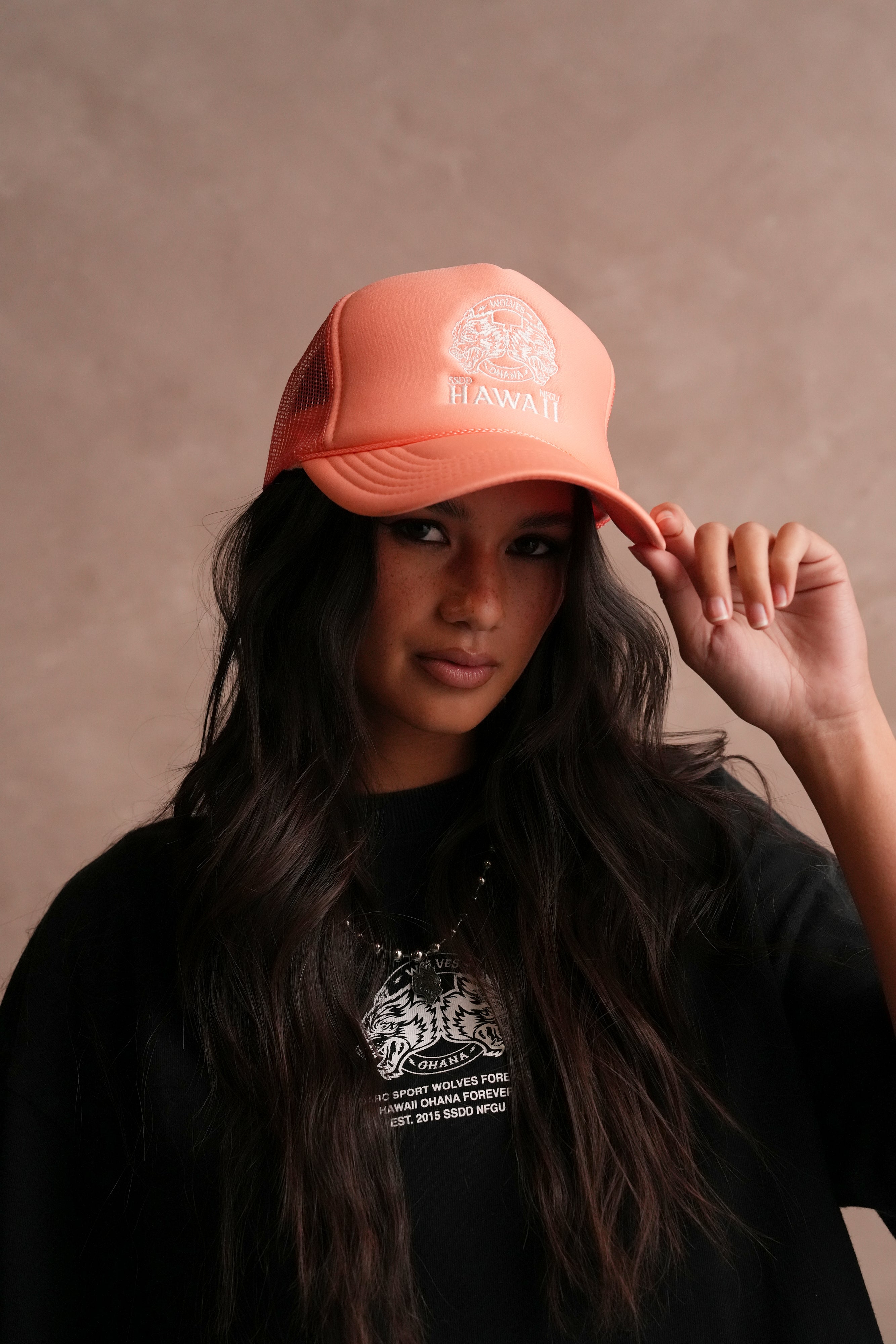 Wolves Ohana Trucker Hat in Neon Coral
