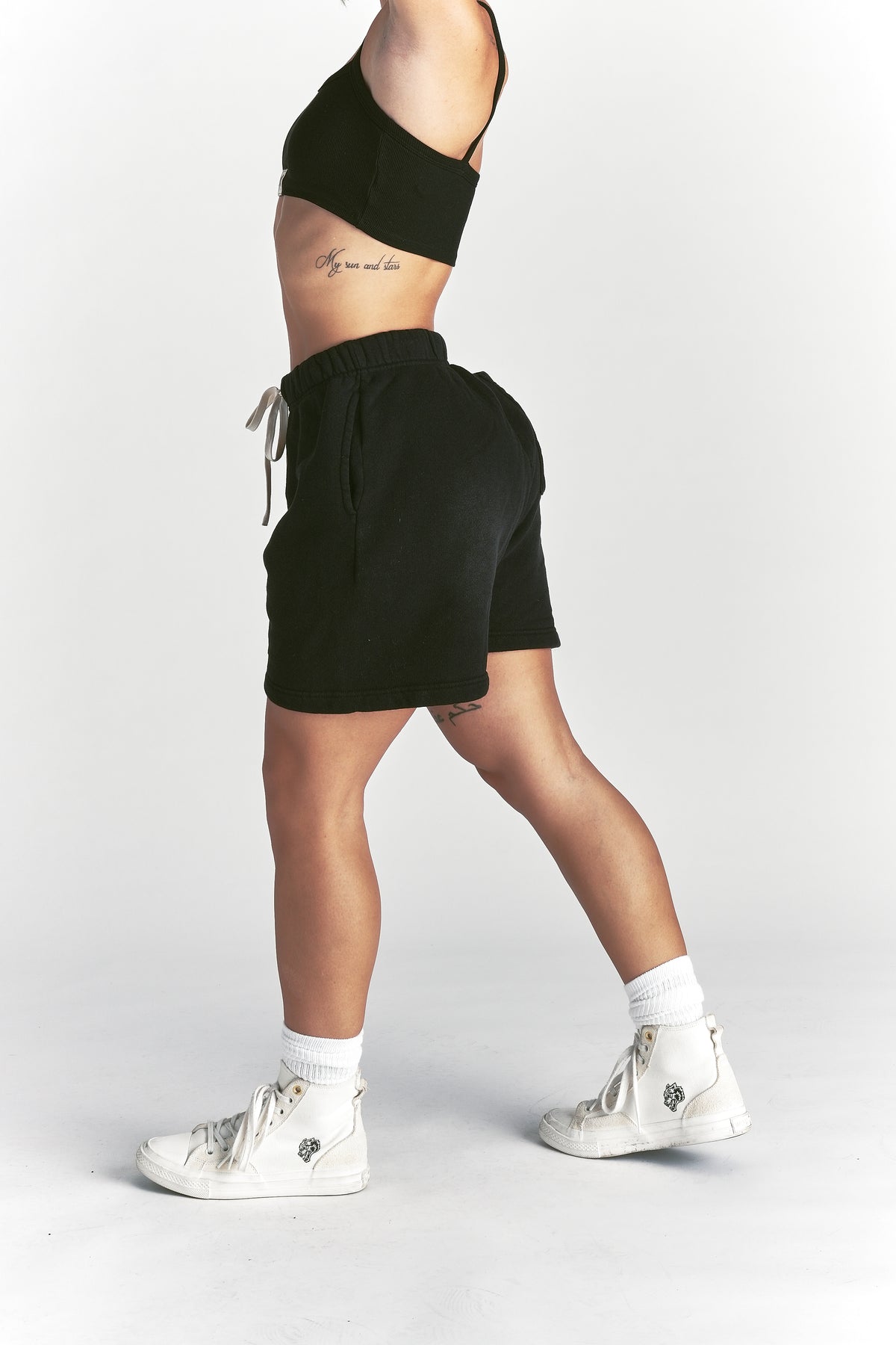 IYKYK Patched Oversized Sweat Short in Black Sun Fade