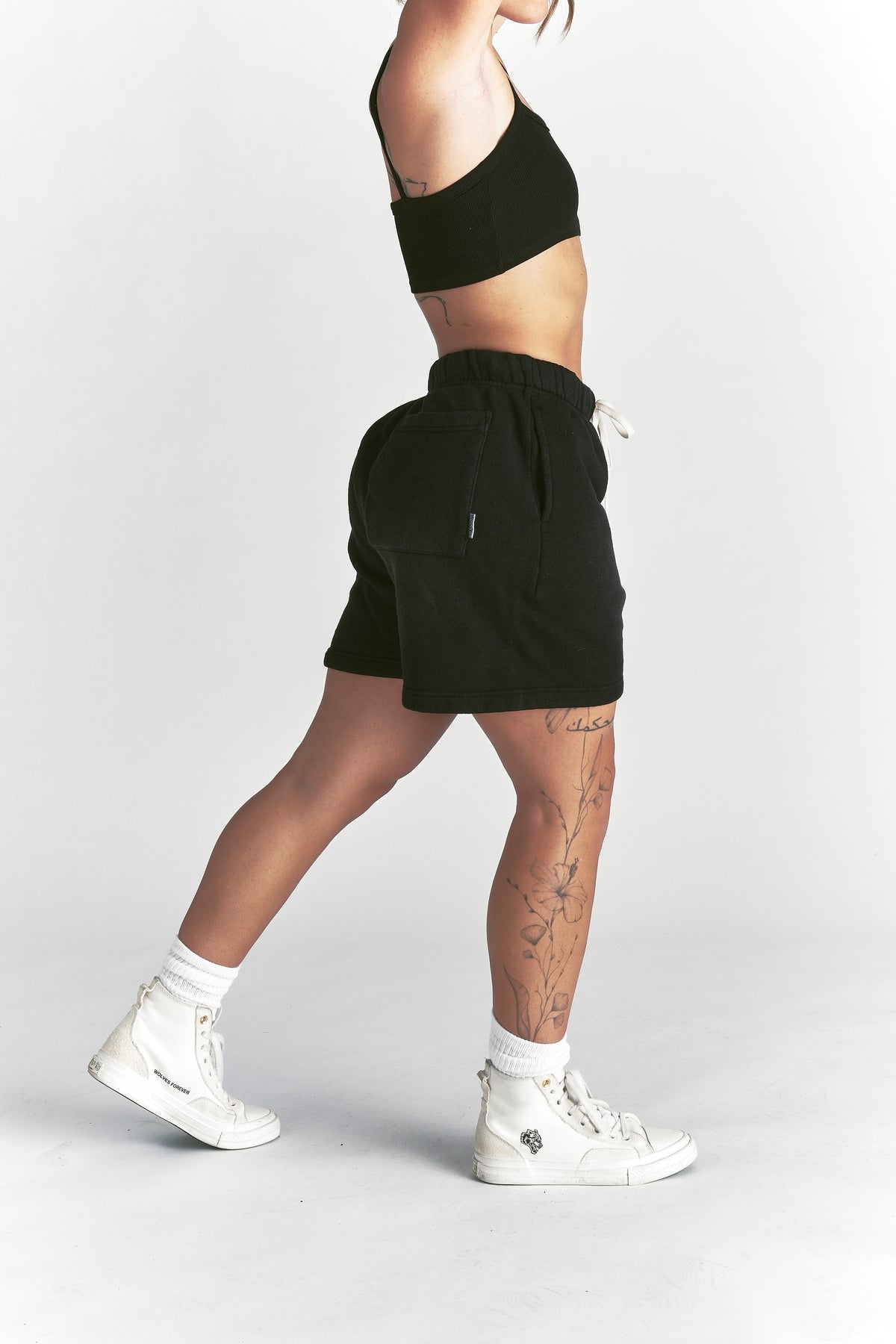 IYKYK Patched Oversized Sweat Short in Black Sun Fade