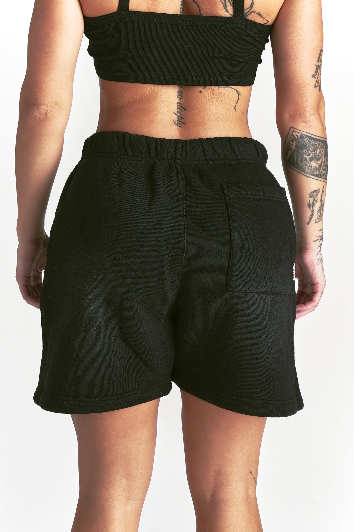 IYKYK Patched Oversized Sweat Short in Black Sun Fade